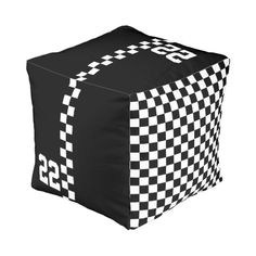 a black and white checkered cube with numbers on it