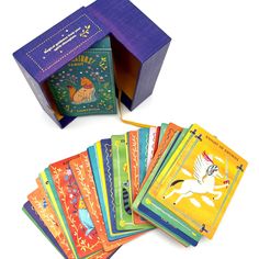 several children's playing cards in a purple box