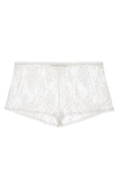 These flirty and modern shorties feature the exquisite floral French lace from our Swan Queen collection. Cut in a flattering mid-rise silhouette with intricate lace flowers that blossom across the body. Finished with a soft organza ruffle stretch waist for comfort and French lace trimmed legs. Available in Ivory and Black. True to size. Handmade in the USA.