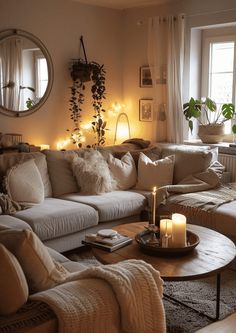 a living room filled with furniture and candles