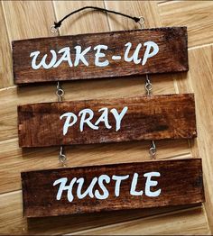 three wooden signs that say wake up, pray hustle and wake up on them