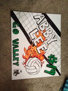 there is a sign that says happy birthday to the volley ball player on fire with flames coming out of it