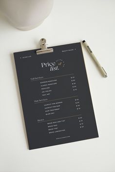 a price list on a clipboard next to a pen