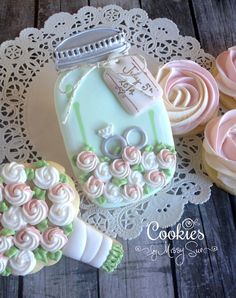 decorated cookies are sitting on a doily