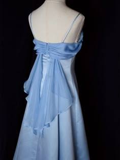 Step into timeless elegance with this Vintage Blue Satin Gown. Crafted from luxurious satin, this dress features delicate spaghetti straps that provide a graceful and feminine silhouette. The highlight of this gown is its unique winged back design, adding a touch of whimsy and sophistication. Perfect for formal occasions, evening events, or any special celebration, this elegant dress ensures you'll make a stunning entrance. The vintage blue hue adds a classic touch, making it a versatile additio Blue Long Prom Dresses, Hot Prom Dress, Long Party Dress, Prom Dress Inspiration, Pretty Prom Dresses, Black Prom Dresses, Prom Dresses Lace, Hoco Dresses, Prom Dresses Blue