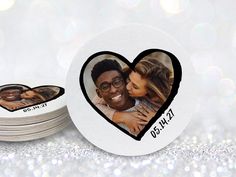 two heart shaped coasters with an image of a man and woman