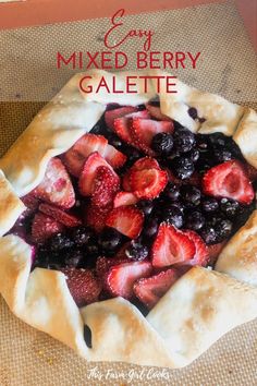 a close up of a pie with berries on it and the title text overlay reads easy mixed berry galette