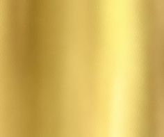 a close up view of a gold metallic background