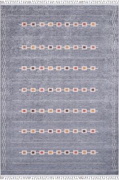 a blue rug with different colored squares and fringes on the bottom, in front of a white background