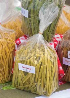 several bags of pasta sitting on top of a table