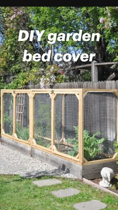 an outdoor garden area with various plants in the fence and on the ground next to it