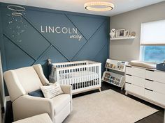 a baby's room with a white crib and rocking chair