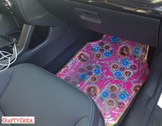 the interior of a car with a colorful seat cover