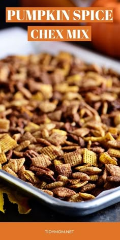 pumpkin spice chex mix in a baking pan with the title overlay reading, pumpkin spice chex mix