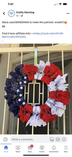 a wreath with red, white and blue bows on it