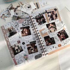 an open notebook with photos and stickers on it