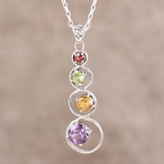 Over five carats of gorgeous gemstones sparkle in this stunning pendant necklace from India. Designed by Alok Jain, faceted round stones of garnet, peridot, citrine, and amethyst glisten elegantly from prong settings. Sleek silver rings of sterling silver enclose the precious gems, accentuating the beautiful and feminine design. Elegant Multi-stone Crystal Necklace As Gift, Round Multi-stone Sterling Silver Birthstone Necklace, Rainbow Palette, Silver Chandelier Earrings, Citrine Necklace, Ruby Pendant, Gemstone Jewellery, Sterling Silver Dangle Earrings, Gemstone Necklace Pendant