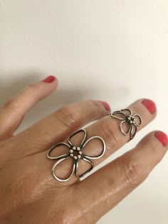 This is a handcrafted Sterling silver flower ring which is made to order in your preferred size.  I make these rings out of 16 gauge Sterling silver wire individually, they don't come from a mold. Each ring is a unique, one of a kind piece of jewelry.   The flower is around 1 1/4 inch tall and wraps around your finger with a double ring band. The ring is blackened and polished to shine.  You will love this ring if you like: - large rings - statement ring - flowers in jewelry - easy to wear rings Handmade Rings Silver, Silver Flower Ring, Rings Silver, Dope Jewelry, Funky Jewelry, Jewelry Lookbook, Lace Flower, Handmade Rings, Silver Rings Handmade