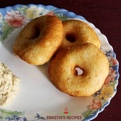 two doughnuts on a plate with cream cheese