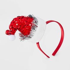 The Girls' Sequins Santa Hat Headband by Cat & Jack™ Red adds a festive sparkle to any holiday outfit. Featuring a cute Santa hat design covered in shimmering sequins, this headband is perfect for Christmas parties, school events or family gatherings. Made from soft, lightweight material, it provides a comfortable fit. Fun and festive, this headband is a must-have accessory to spread holiday cheer and complete any Christmas look. Cat & Jack™ - Designed for all children so you can trust it's made Adjustable Christmas Holiday Headband, Adjustable Headband For Holiday Festivities, Christmas Party Adjustable Hair Accessories, Adjustable Mini Hats For Christmas Party, Adjustable Red Winter Headband, Red Adjustable Headband For Winter, Adjustable Red Headband For Winter, Adjustable Christmas Party Hats, Festive Red Adjustable Hat