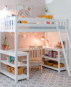 a white bunk bed sitting next to a desk and bookshelf in a room