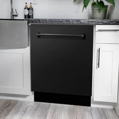 a black dishwasher sitting inside of a kitchen