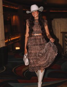 Explore the perfect blend of country and casual with our edit of 15 chic rodeo outfits for women! These Western outfit ideas are perfect for any cowgirl looking to elevate their 2024 look, whether you're attending a show in Houston, Texas, the NFR, or another event in the country. As an example, we love this classy look with a midi dress and white cowboy boots. Elegant Cowboy Outfit Women, Chic Western Outfits Party, Country Cowboy Outfits, Fancy Western Dress, Western Outfits Women Birthday, Country Party Theme Outfit, Woman Cowboy Outfit, Dressy Western Outfits Women Stylish, Texas Glam Outfit