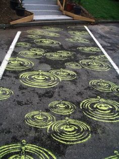 an empty parking lot with yellow circles painted on it