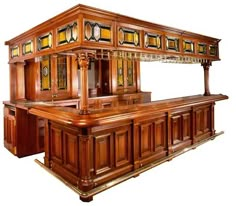 a large wooden bar with stained glass windows on the front and back sides, in an antique style