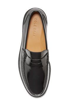 A slim penny slot vamp adds a vintage contrast to this high-polish leather loafer that offers a sophisticated appeal. Moc toe Slip-on style Leather upper, textile lining, rubber sole Imported