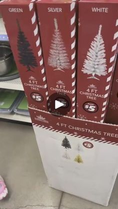 four christmas tree boxes are stacked on top of each other