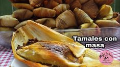 tamales con masa on a plate next to other food items