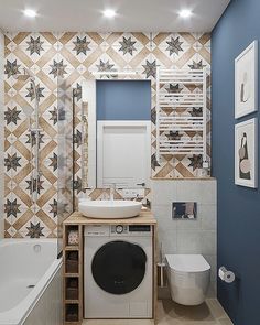 a bathroom with a washer and dryer in it