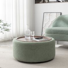 a living room scene with focus on the coffee table and chair in the foreground