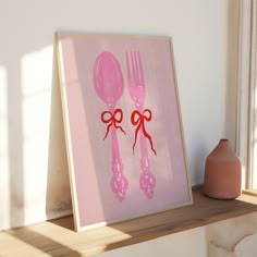 a pink painting with two forks and spoons on the wall next to a vase