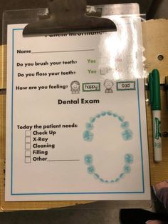 a clipboard with instructions on how to brush your teeth and what to do if you have dental exam