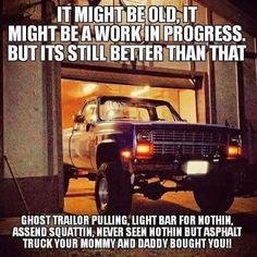 a truck parked in front of a garage door with the words, it might be old, might be work in progress but it's still better than that