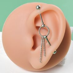 a fake ear with a ring and chain attached to it