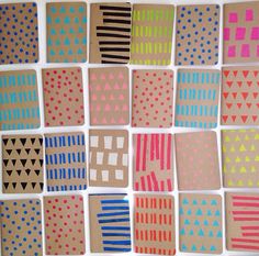 several pieces of paper with different designs on them, all in different colors and shapes