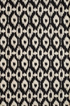 a black and white rug with an animal print pattern