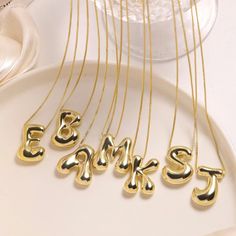 Elevate your style with our Gold Color Chunky Stainless Steel Waterproof Monogram Necklace. Made of durable and trendy stainless steel, this necklace features a bold and eye-catching gold color. Choose your own initial to add a personal touch and make a statement. A perfect gift for yourself or a loved one. Bubble Letter, Letter Jewelry, Letter Pendant Necklace, Initial Necklace Gold, Monogram Necklace, Waterproof Jewelry, Gold Initial, Letter Pendants, Unisex Jewelry