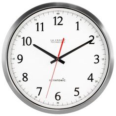 an analog clock with red hands and numbers on the face is shown against a white background