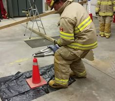 a fireman is working on something in the air