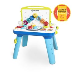 a child's toy table with gears on it and award for best children's play area