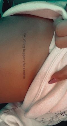 the back of a woman's stomach with an inscription on it