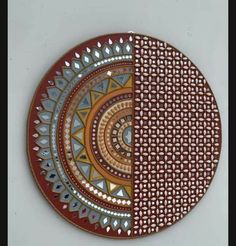 two plates with different designs on them, one is brown and the other is red