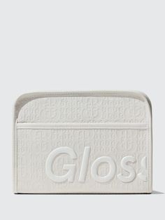 a white purse with the word glos on it