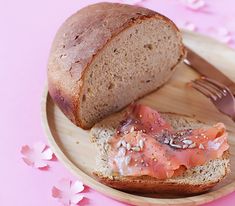 there is a piece of bread with salmon on it and a fork next to it