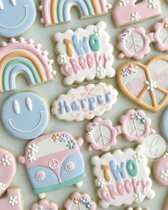 decorated cookies with rainbows, clouds, hearts, and words that spell out love