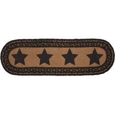 a door mat with three stars on the front and one star on the back, in brown